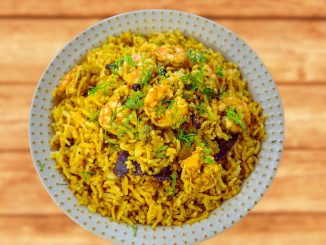 prawn pulao on a wooden table.